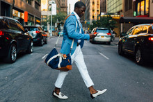 Young Businessman Walking In The Street In New York City