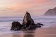 Coastal rock stack Sunset at Gray Whale Cove State Beach. Half Moon Bay, San Mateo County, California, USA.
