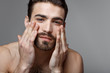 © Leandro Crespi/Stocksy - Handsome young man beauty session.