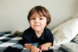 © Maria Manco/Stocksy - little boy looks at camera