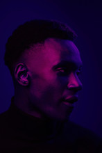 African American Man Portrait Under Blue And Purple Lights - Ultraviolet