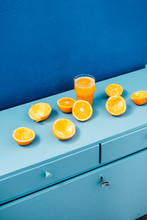 Orange Juice On Blue Background