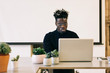 © VISUALSPECTRUM/Stocksy - Portrait of Hip African American Man Working on Laptop