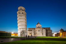 Night View Of Pisa Cathedral (Duomo Di Pisa) With Leaning Tower Of Pisa (Torre Di Pisa) On Piazza Dei Miracoli In Pisa, Tuscany, Italy. The Leaning Tower Of Pisa Is One Of The Main Landmark Of Italy
