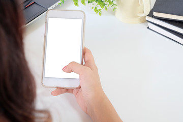 Closeup hand using mockup smartphone.