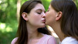 © motortion - Cute lesbians kissing passionately, public demonstration of love, lgbt rights