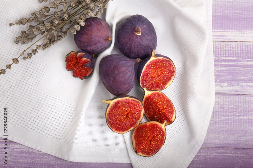 Fresh ripe figs on wooden table