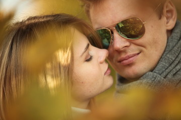 Wall Mural - couple people young man and women walking autumn park fanny sunny day