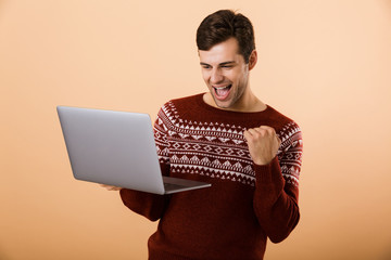 Sticker - Portrait an excited young man dressed in sweater