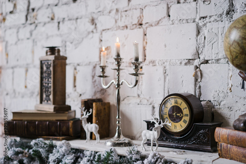 Vintage Christmas Decorations On The Fireplace Candles Books And