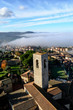 A nice view from a medieval tower in San Gimignano, tuscany Italy. A small old perched town surrounded by a natural fog in the valley during a sunny winter day