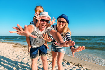 funny happy family on the beach