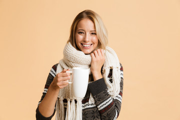 Sticker - Portrait of a happy girl dressed in sweater and scarf