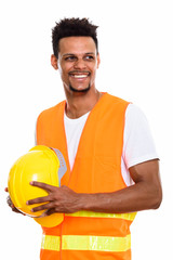 Thoughtful happy African man construction worker smiling while h