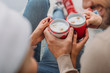 © LIGHTFIELD STUDIOS - cropped image of couple clicking with cups of cappuccino at home, christmas concept