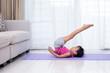 © Tan Kian Khoon - Asian Chinese little girl practicing yoga pose on a mat