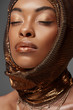 © LIGHTFIELD STUDIOS - portrait of attractive african american model with head wrap and eyes closed isolated on grey