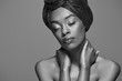 © LIGHTFIELD STUDIOS - black and white photo of stylish african american woman with eyes closed isolated on grey