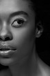 © LIGHTFIELD STUDIOS - black and white photo of african american woman looking away isolated on black
