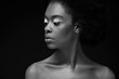 © LIGHTFIELD STUDIOS - black and white photo of beautiful african american woman isolated on black