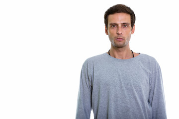 Studio shot of young handsome man looking at camera