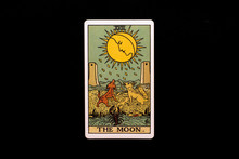 An Individual Major Arcana Tarot Card Isolated On Black Background. The Moon.