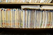 © Gene - The medical records are stacked neatly in the Doctor's office.