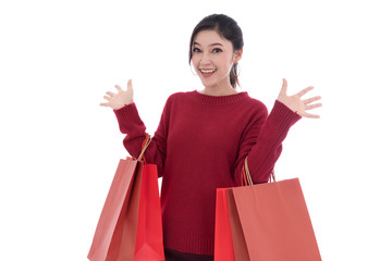 cheerful woman holding red shopping bag isolated on white background