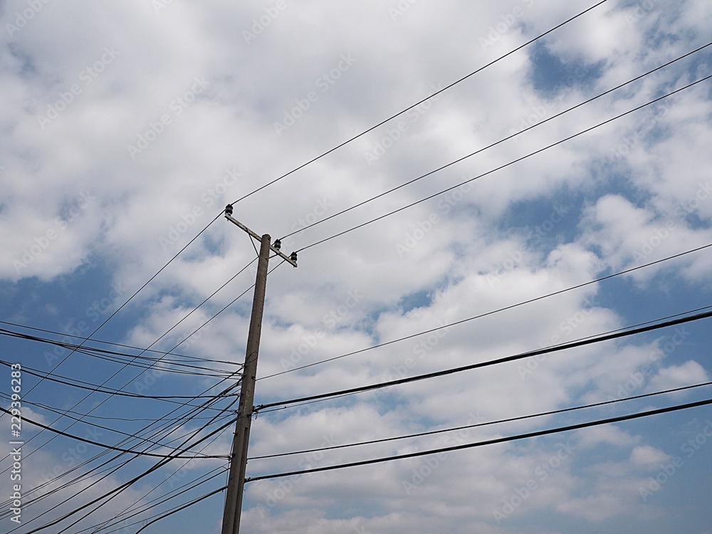 electrical wires on electric poles on blue sky background Stock Photo ...