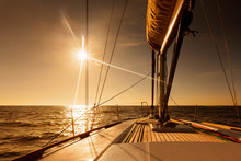 Sailing Towards Sunset At Open Sea