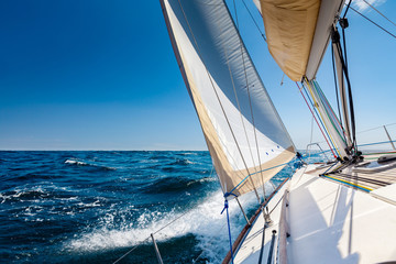 Sailing lboat at open sea in sunshine