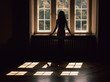 © Tomasz - Young woman silhouette, looking through the window, strong shadows