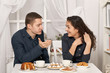 © soleg - romantic couple drinking tea with cookies and talking