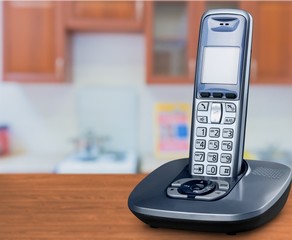 cordless phone with cradle on white background