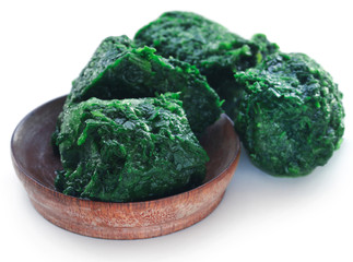 Sticker - Spinach cube as frozen product in a bowl