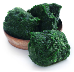 Sticker - Spinach cube as frozen product in a bowl