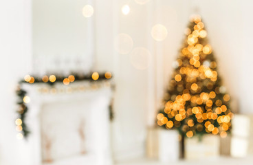 holiday decorated room with christmas tree and decoration, backgroound with blurred, sparking, glowi