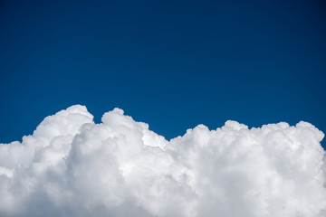 Wall Mural - closeup cumulus cloud with blue sky, convectional and veretical clouds