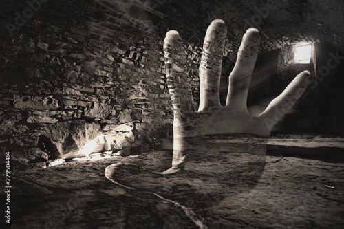 Cuadros en Lienzo Creepy hand in the dark cell, double exsposure