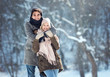 © Tijana - Two young people enjoying in the snow