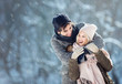 © Tijana - Two young people enjoying in the snow