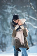 © Tijana - Two young people enjoying in the snow