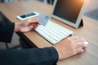 © feeling lucky - businesswoman hands using table, cell phone and credit card