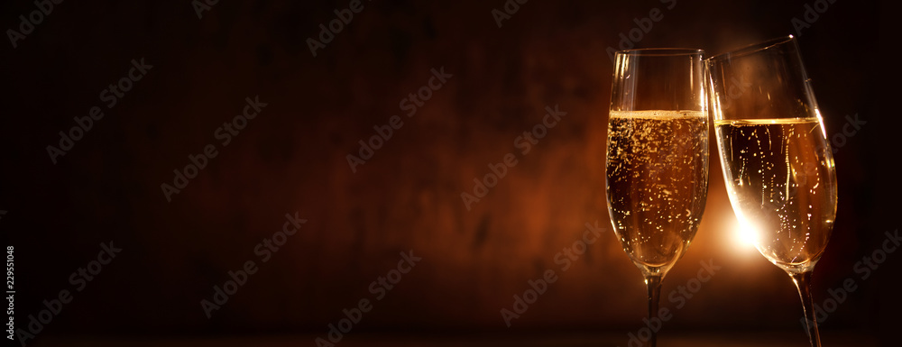 Clink glasses with champagne for a new year - obrazy, fototapety, plakaty 