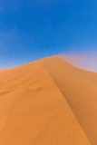 Fototapeta Nowy Jork - Sand blowing over Big Daddy Dune, Sossusvlei, Namib-Naukluft National Park, Namibia.