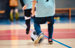 © matimix - Young futsal players and soccer ball with motion blur. Indoor futsal soccer players in motion playing futsal match. Indoor soccer sports hall. Sport players kicking match. Futsal training dribble