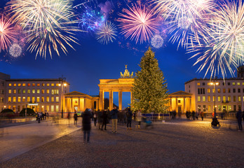 Poster - Bradenburg Gate with Christmas tree illuminated at night with fireworks, Berlin Germany