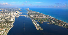 Aerial View Of Downtown West Palm Beach, Florida, With The Lake Worth Lagoon, And Palm Beach,  In South Florida.