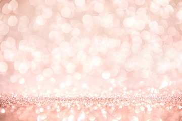 rose gold and pink glitter, defocused abstract holidays lights on background.