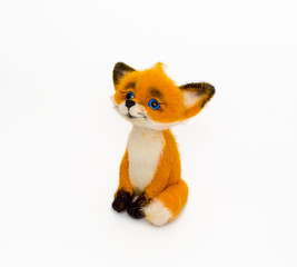 Felted toy cheerful red fox sitting